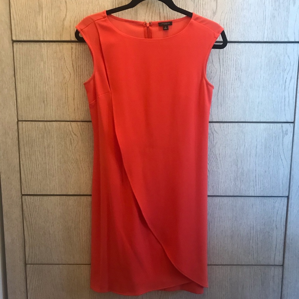 Orange sleeveless drape front dress